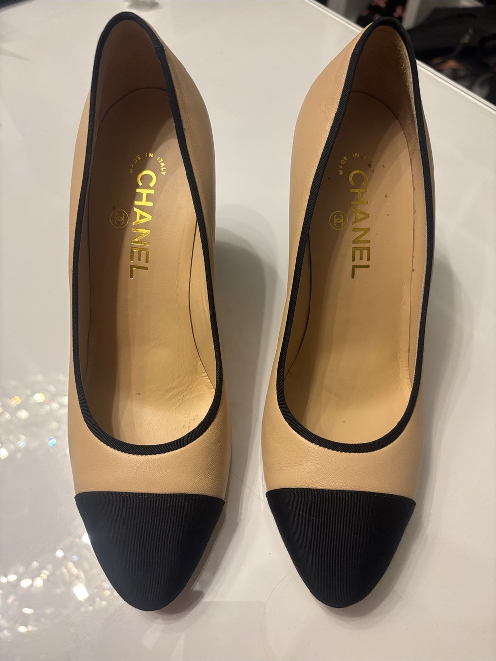 CHANEL Beige Leather Pumps with Black Cap Toe